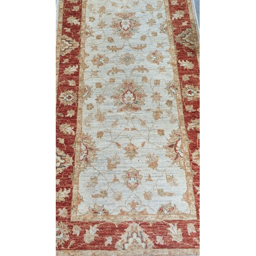 122 - A Handmade Carpet Runner, 335 x 78cm.