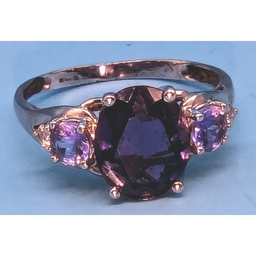 404 - A 9ct White Gold and Tanzanite Ring with a Large Central 2ct Stone with Smaller Tanzanite accents to... 