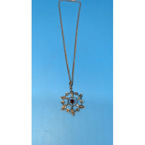 405 - A 9ct Gold Necklace with Garnet and Seed Pearl Pendant. 7.6g