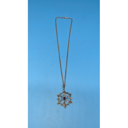 405 - A 9ct Gold Necklace with Garnet and Seed Pearl Pendant. 7.6g