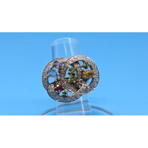 413 - An 18ct Yellow Gold Contemporary Ring encrusted with Diamonds and Multi Coloured Stones. 14.6gms. Si... 