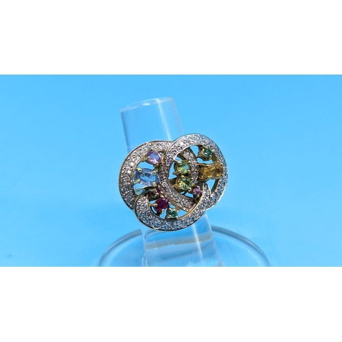 413 - An 18ct Yellow Gold Contemporary Ring encrusted with Diamonds and Multi Coloured Stones. 14.6gms. Si... 