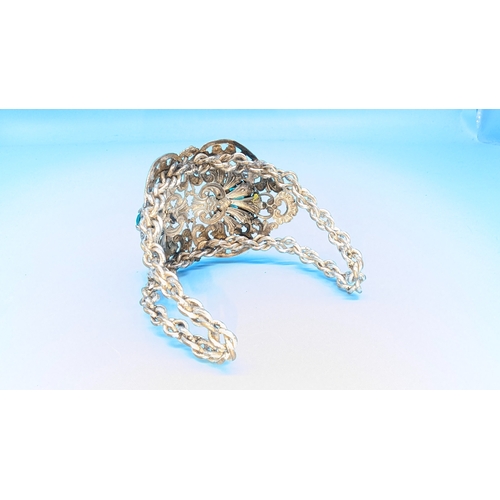 437 - A White Metal Bangle set with Green Stones.