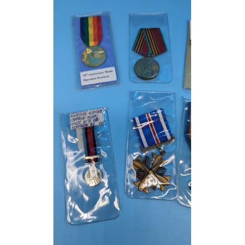 587 - Reproduction Medals, A Victoria Cross, Flying Cross, Distinguished Service Cross, 50th Anniversary M... 