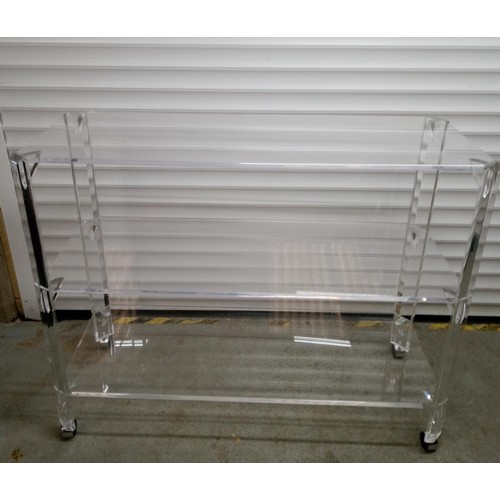 622 - 2 x Akiko Perspex Shelving Units with 3 Shelves on Castors. 99cm H x 125cm W x 49cm D.