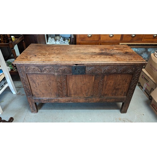 154 - An antique oak coffer with carved detailing - 130 x 56 x 74 cm