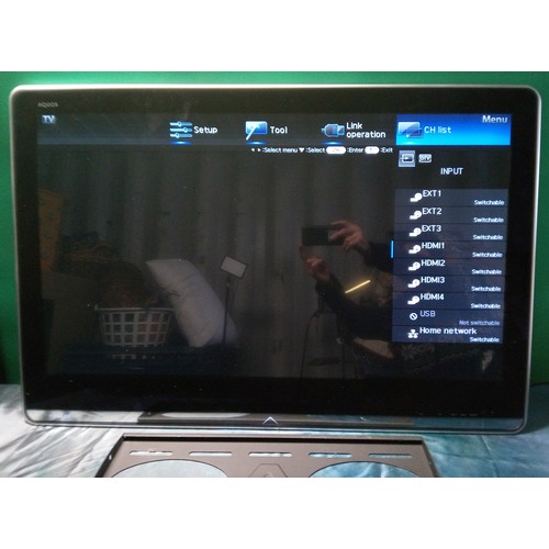 824 - Sharp Aquos TV with wall mount (no stand) - Model Number LC - 40LE821E