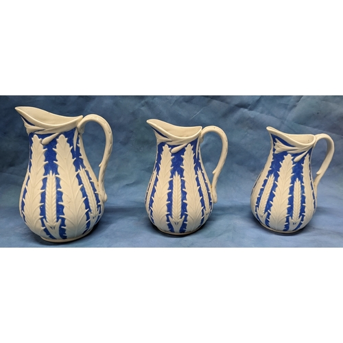 129 - A set of 3 graduated Victorian relief moulded jugs