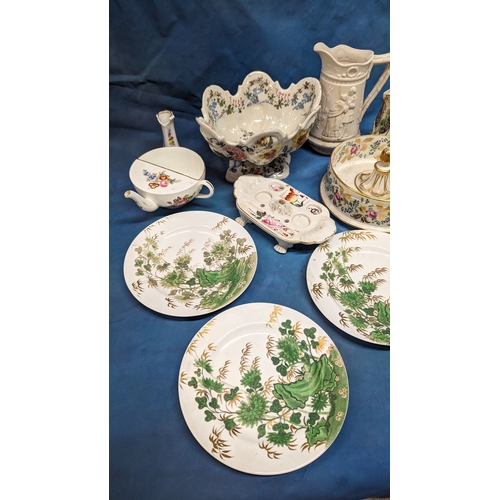 130 - An assortment of antique Chinaware plates and jugs including: Faience and creamware feeding cup, che... 