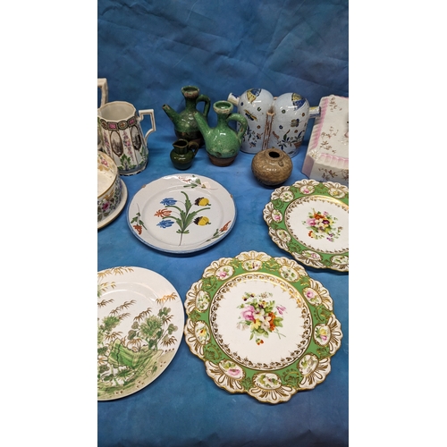 130 - An assortment of antique Chinaware plates and jugs including: Faience and creamware feeding cup, che... 