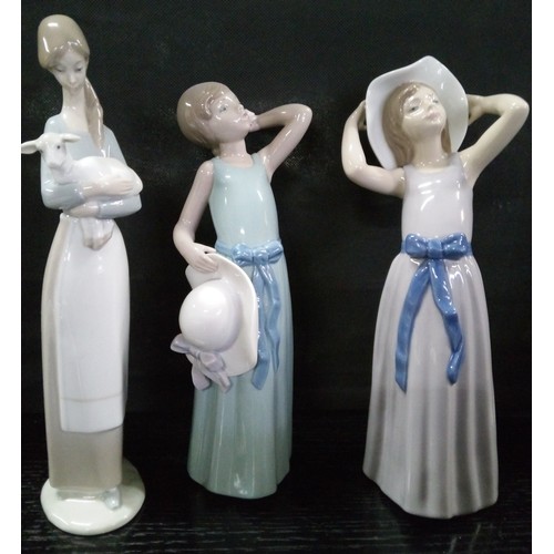 496 - Three Lladro Figures.