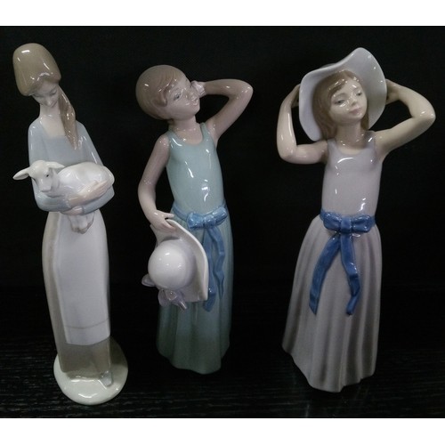 496 - Three Lladro Figures.