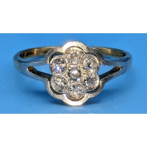 398 - 18ct Yellow Gold and diamond daisy ring in a platinum settings size N/0