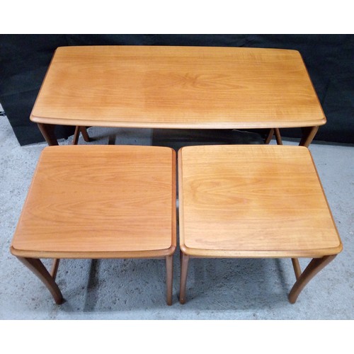 462 - A Mid Century Teak Nest of Three Tables.  50cm H x 97cm W x 47cm D.