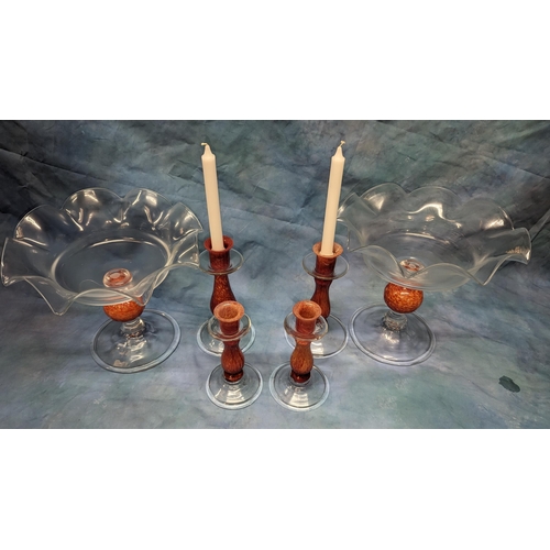 54 - A set of studio glass candle sticks and tazzas.