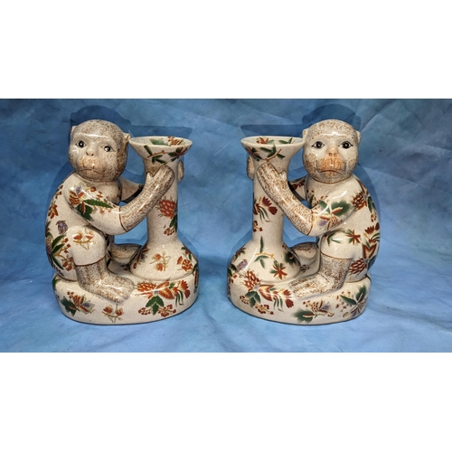 79 - A Pair of Porcelain Monkey candlestick holders