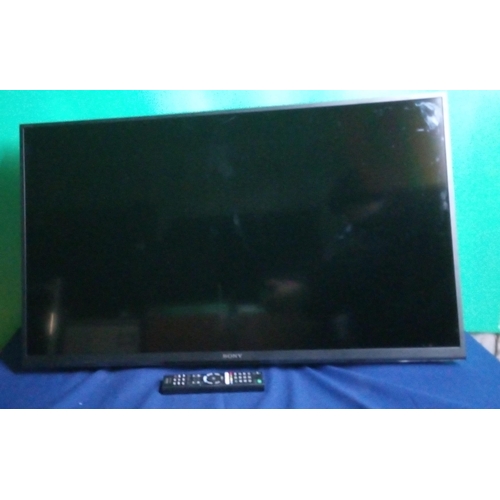 858 - 40 Inch Sony tv - wall mounted with remote - model KDL-40WE663