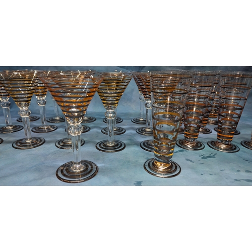 101 - A Quantity of Gold banded cocktail glasses and  champagne style highball glasses