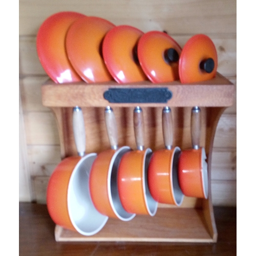 140 - Le Creuset Sauce pan set with lids and stand - ORANGE