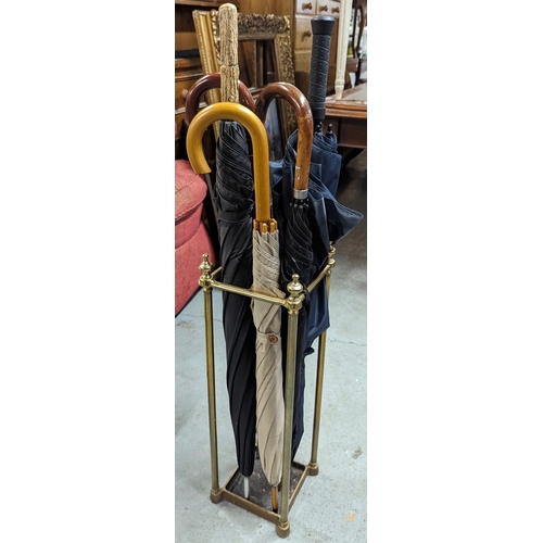 335 - A Brass Umbrella Stand including Silver Collard and other Umbrellas