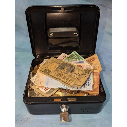 517 - An assortment of Worldwide coins and banknotes in cash tin (with key)