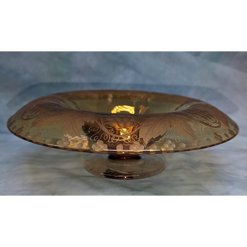 99 - Amber glass 19th century pedestal bowl with grape and vine motifs - 29cm diameter and 9cm tall