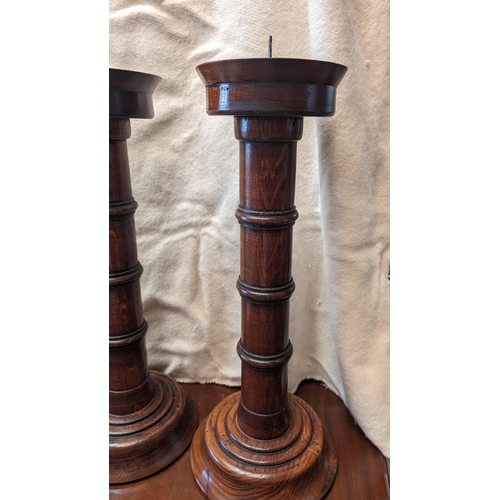 21 - A pair of large English hand carved ecclesiastical candlesticks - 55cm tall