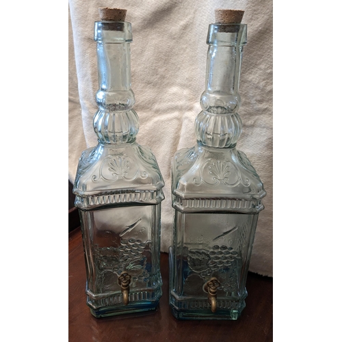 226 - 2x Large vintage bottles with taps decorated with vines and grapes