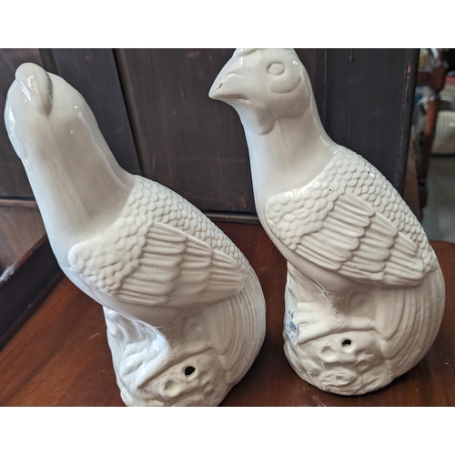 566 - 2x White porcelain opposing sides china bird ornaments - hollow inside - 32cm high