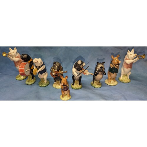 80 - A collection of Beswick Pig Proms / Band figurines - Flute player missing flute