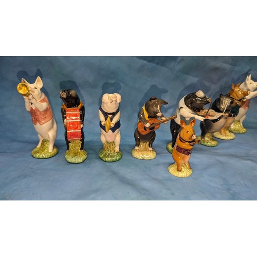 80 - A collection of Beswick Pig Proms / Band figurines - Flute player missing flute