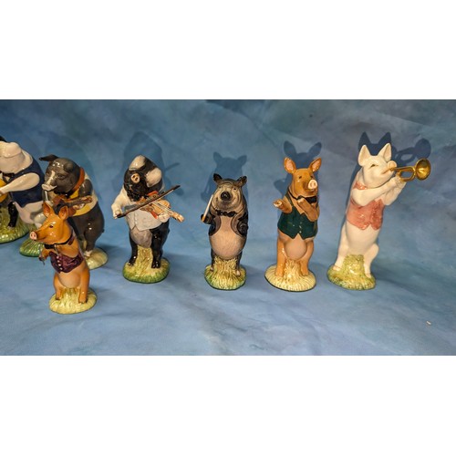 80 - A collection of Beswick Pig Proms / Band figurines - Flute player missing flute