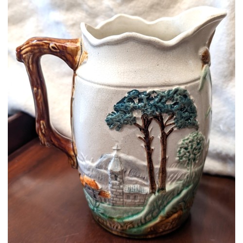 314 - Antique hand-painted porcelain pitcher depicting country scene with church