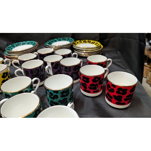 239 - Enzart Designs Leopard Print Coffee Cups and Saucers - 8 x Yellow, 3 x Red, 6 x Purple and 4 x Green... 