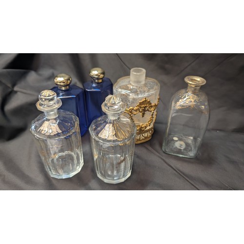 258 - 6 x Antique Perfume Bottles inc. Large brass Overlaid Bottle - no stooper and slight chip to rim