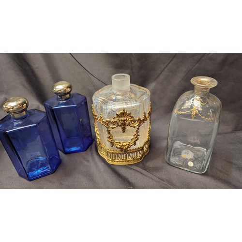 258 - 6 x Antique Perfume Bottles inc. Large brass Overlaid Bottle - no stooper and slight chip to rim