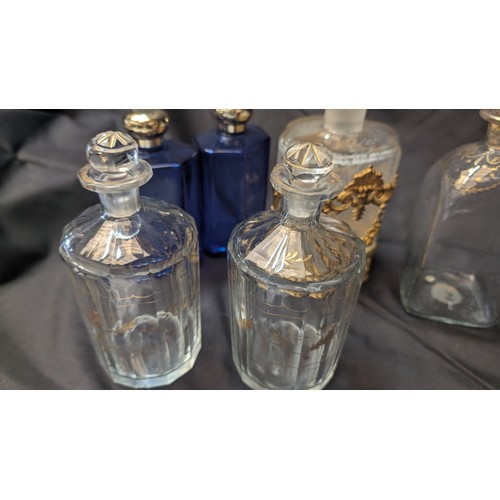 258 - 6 x Antique Perfume Bottles inc. Large brass Overlaid Bottle - no stooper and slight chip to rim