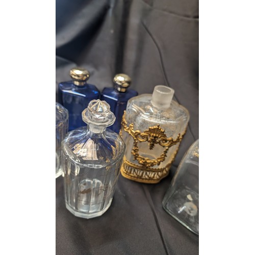 258 - 6 x Antique Perfume Bottles inc. Large brass Overlaid Bottle - no stooper and slight chip to rim