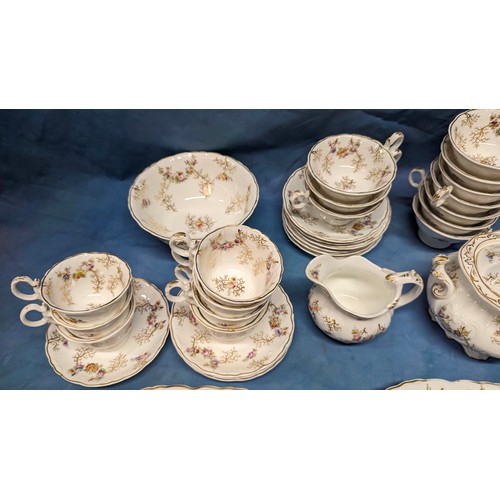 168 - An Antique Part Floral Chintz Tea Service