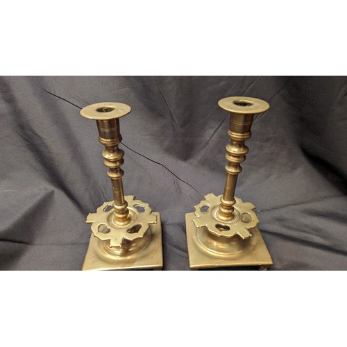 254 - A Pair of Antique Brass Candlesticks with Heart Design Cut Outs