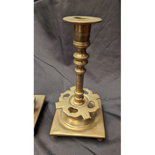 254 - A Pair of Antique Brass Candlesticks with Heart Design Cut Outs