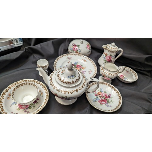 323 - A Quantity of Staffordshire Tea Service x 10 pieces - Rose Design ( slight crack in teapot)