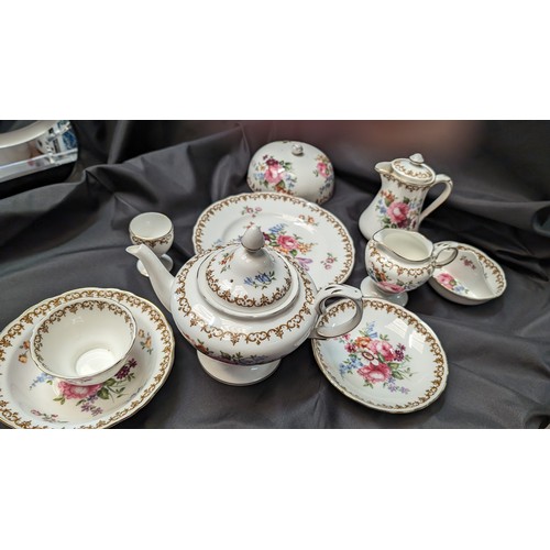 323 - A Quantity of Staffordshire Tea Service x 10 pieces - Rose Design ( slight crack in teapot)