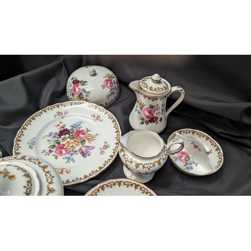 323 - A Quantity of Staffordshire Tea Service x 10 pieces - Rose Design ( slight crack in teapot)