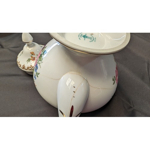 323 - A Quantity of Staffordshire Tea Service x 10 pieces - Rose Design ( slight crack in teapot)