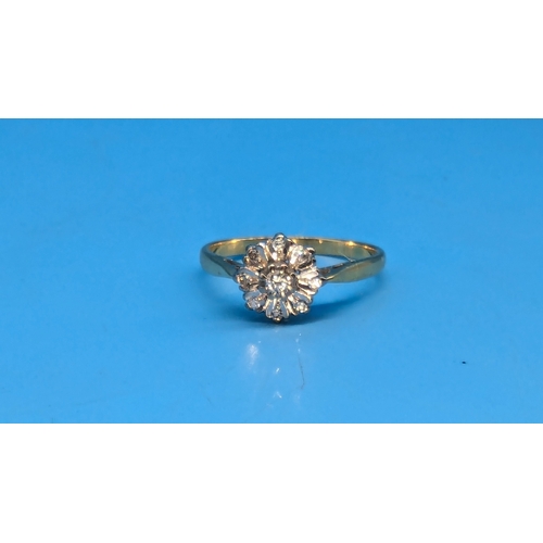 206 - An 18ct Gold and Diamond Daisy Illusion Ring.