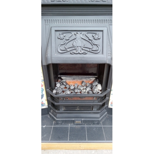 539 - Sun crest electric coal effect fire with floral tile and cast iron effect surround with pine mantle ... 