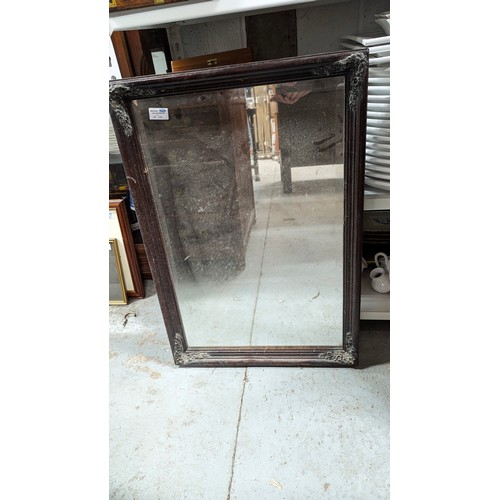 620 - A wooden framed mirror 50 x 74 cm