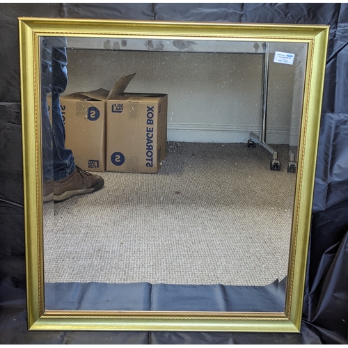 1198 - A bevelled glass mirror in gold frame - 63 x 70cm