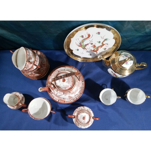 545 - 2 Chinese tea services - one with dragon design, one with Chinese scene